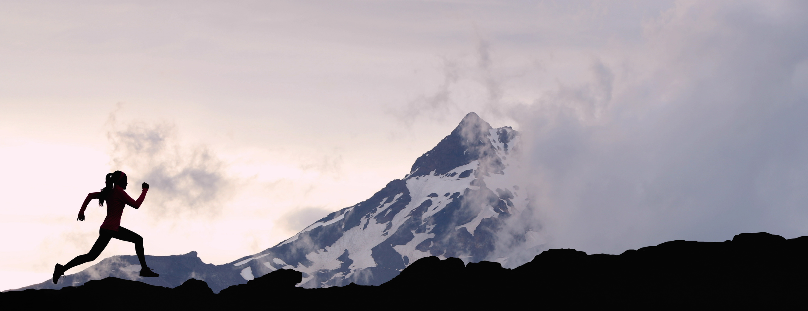 Running Woman Athlete Silhouette Trail Running in Mountain Summit Background